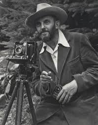 Ansel Adams holding a vintage camera